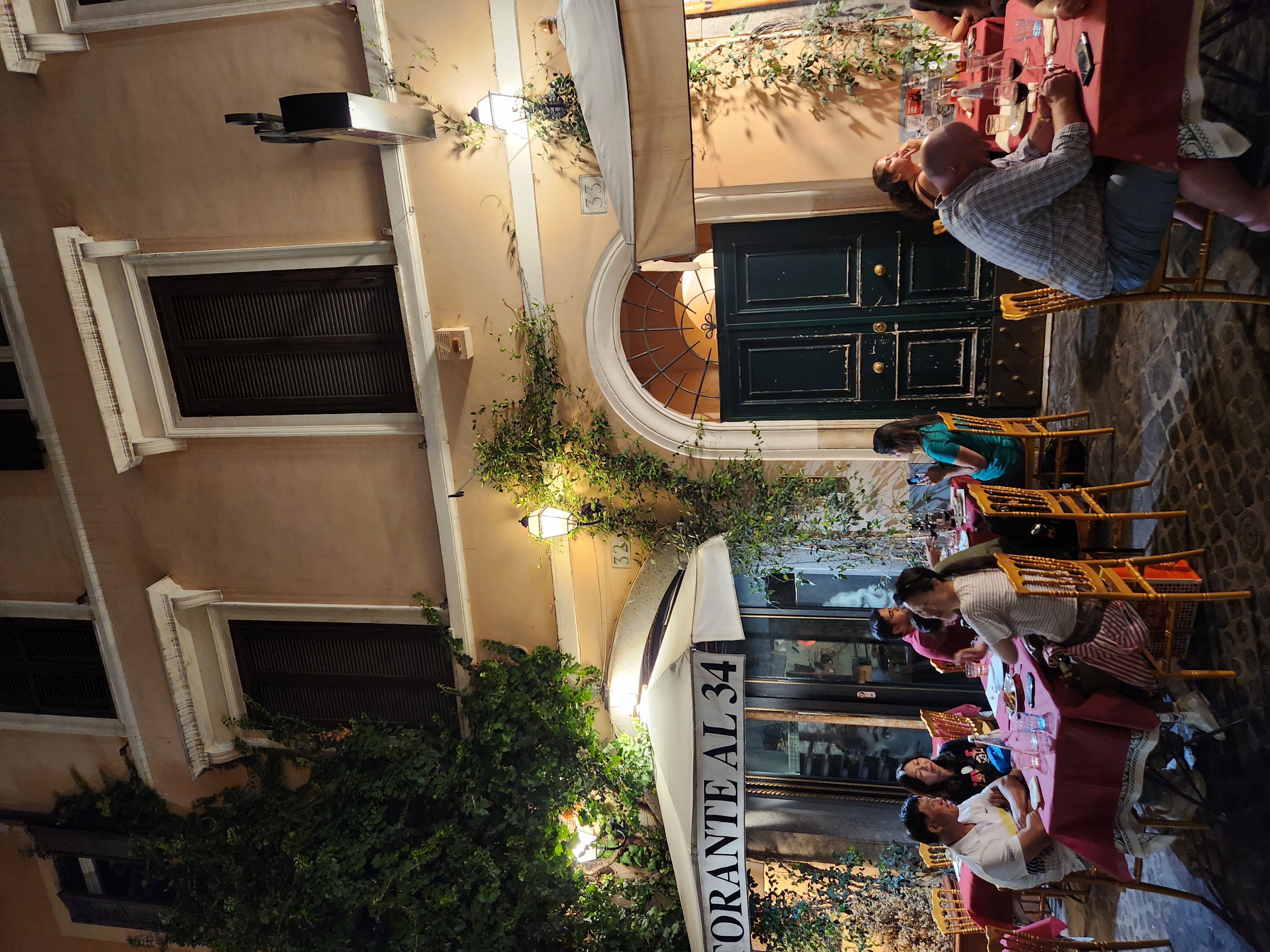 An atmospheric Italian dinner table welcoming a Rome arrival.