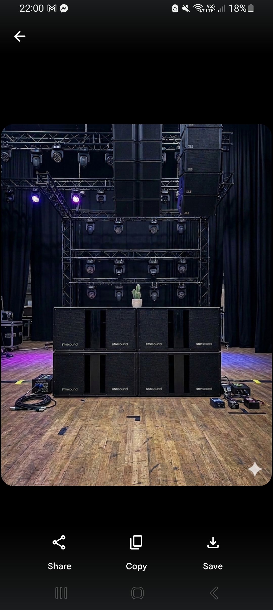 STMSoundOS subwoofer wall stack on stage with lighting rigs