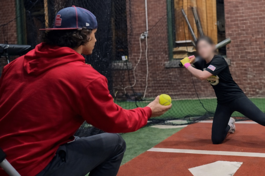 Coach Silvio doing soft toss for batting practice