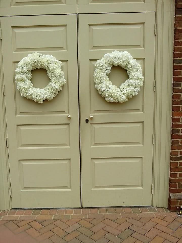 White hydrangea wreaths on double doors