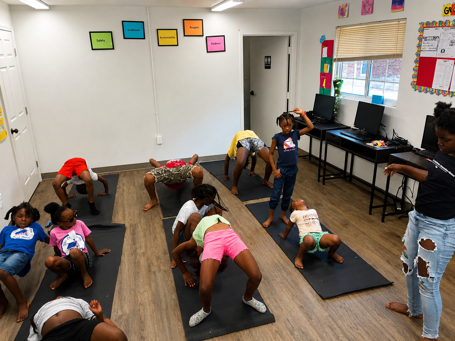 Kids doing yoga poses at Kids Yoga Camp with Gainesville Fire and Rescue, 2024