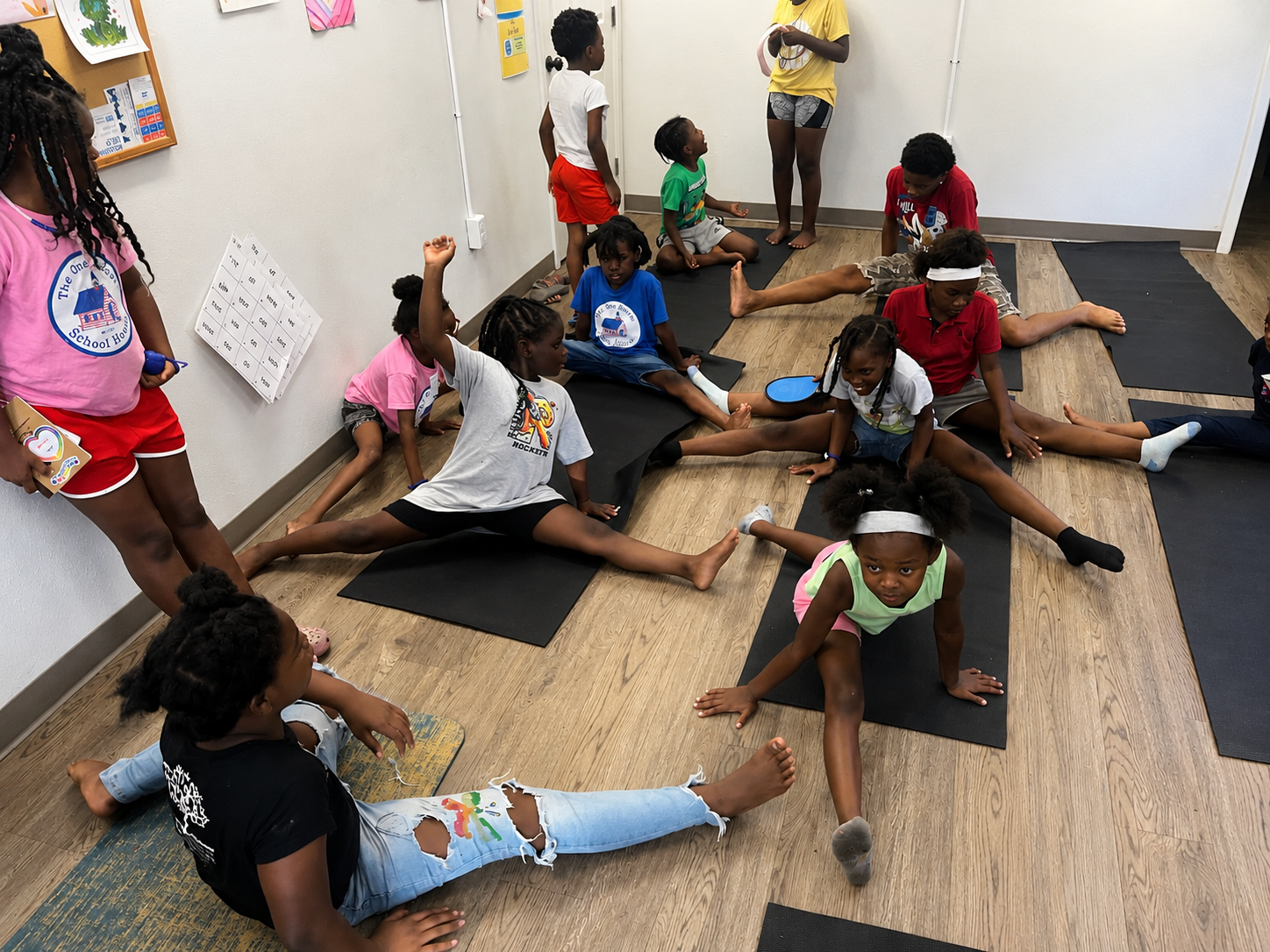 Kids stretching during Kids Yoga Camp with Gainesville Fire and Rescue, 2024
