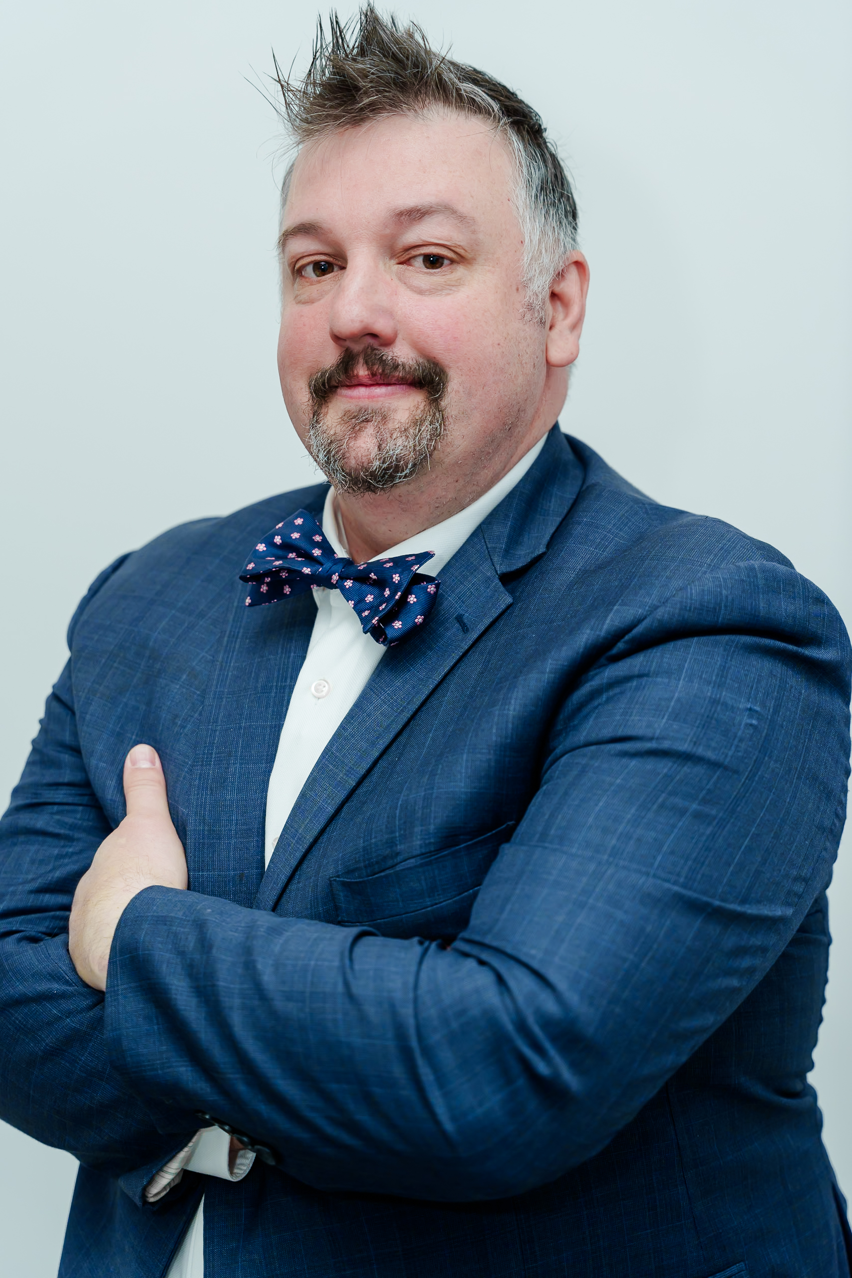 Tim McNeely — Dental Exit Guy, arms crossed, professional headshot