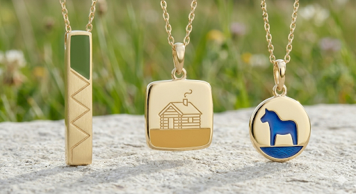 Driftless town pendants — Green Zigzag Bar, Cabin Square, and Blue Dala Horse Circle on stone