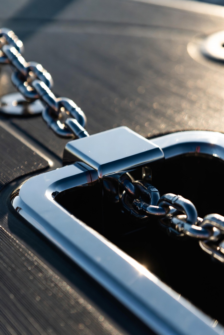 Anchor chain through stainless steel hawse pipe deck fitting on superyacht