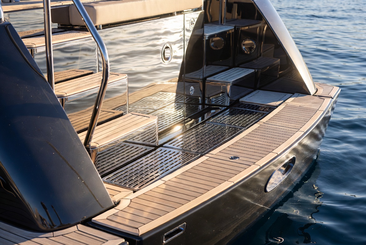 Swim platform with custom stainless steel steps and railings on superyacht