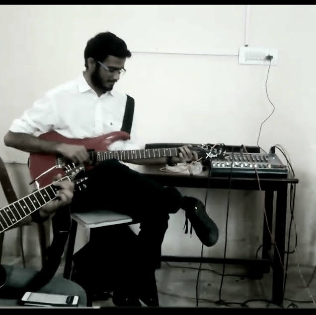 Yashodeep playing electric guitar — multi-instrumentalist