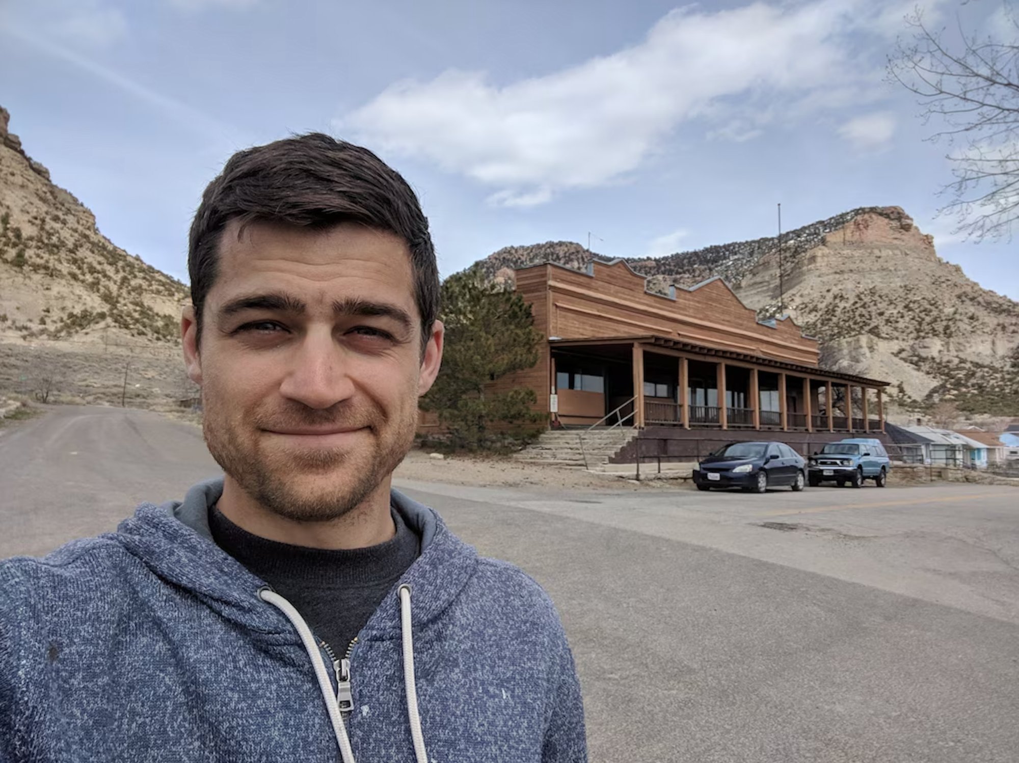 Oran Stainbrook in front of The Old Company Store, Kenilworth, Utah with Helper canyon backdrop