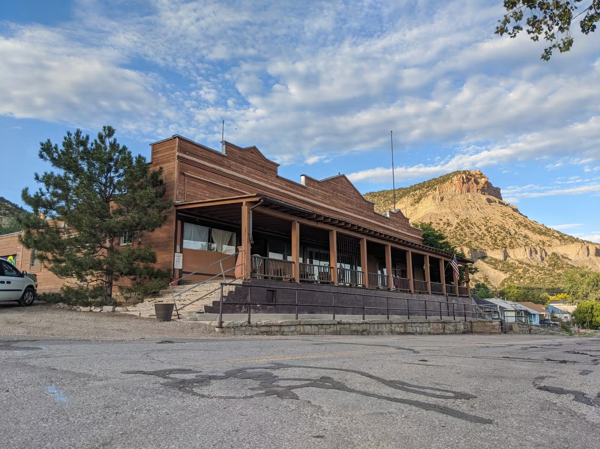 The Old Company Store exterior — western false-front architecture with Helper canyon mesa backdrop