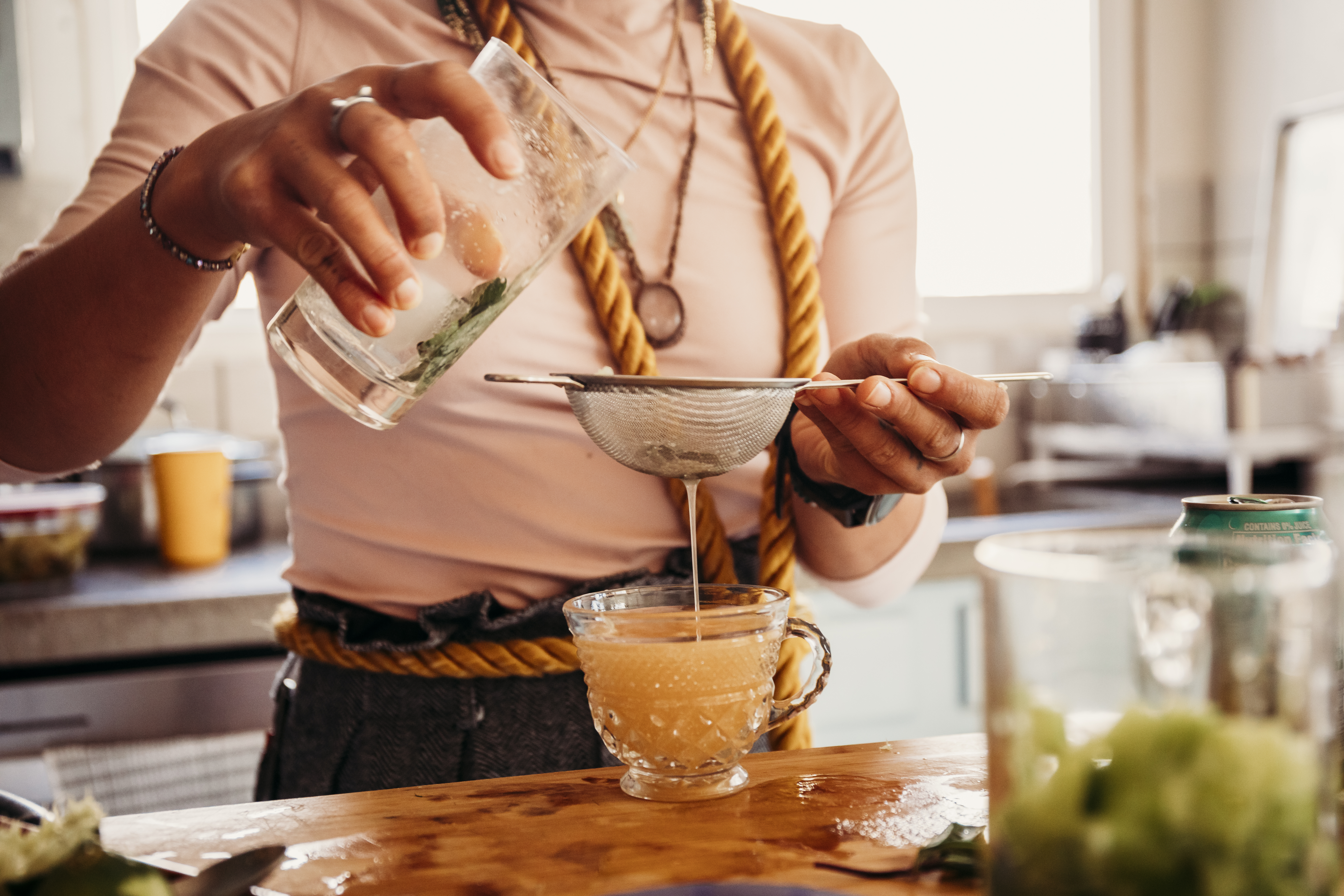 Whiz expertly straining a handcrafted mocktail