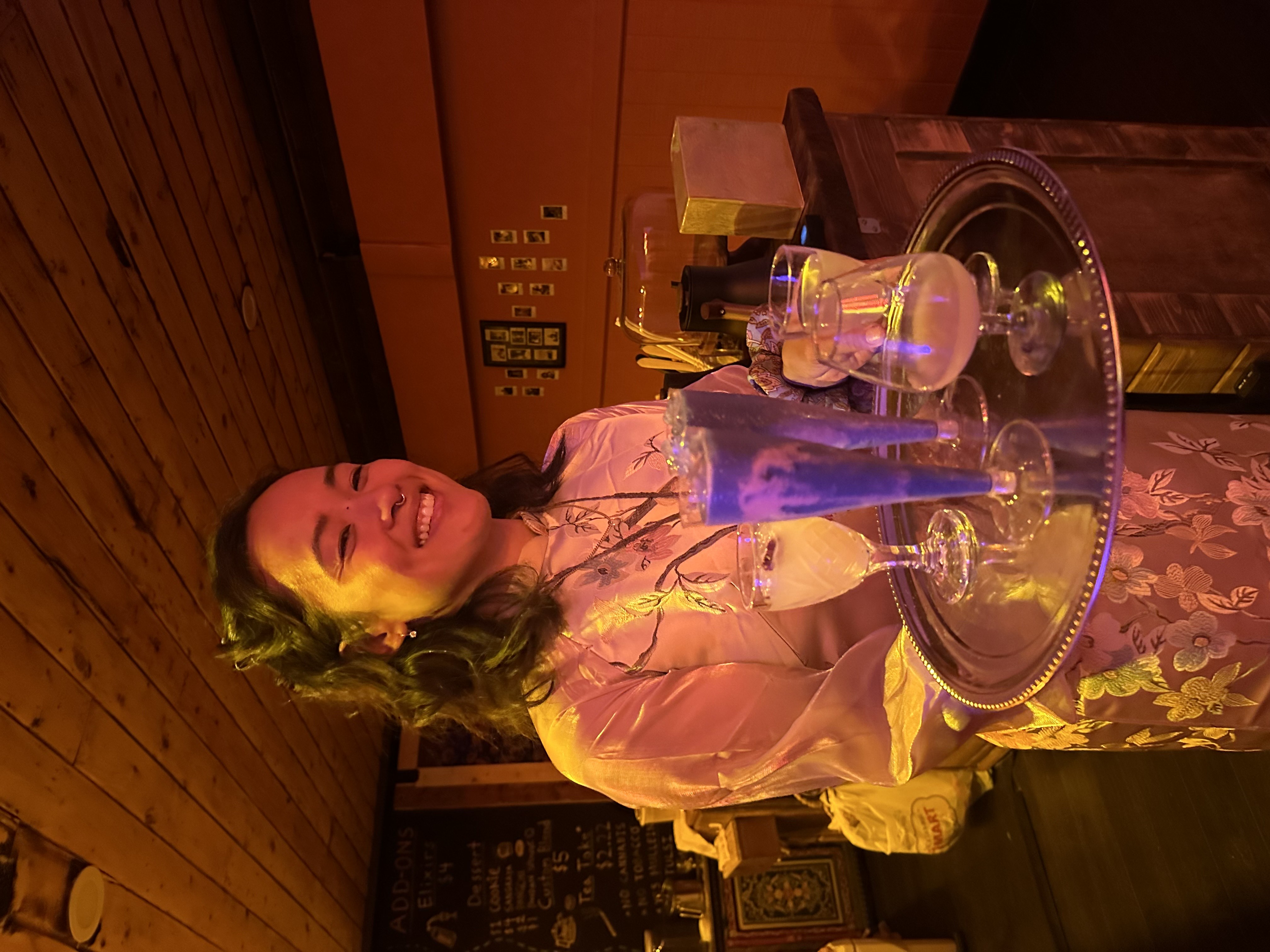 Whiz in áo dài serving mocktails on silver tray