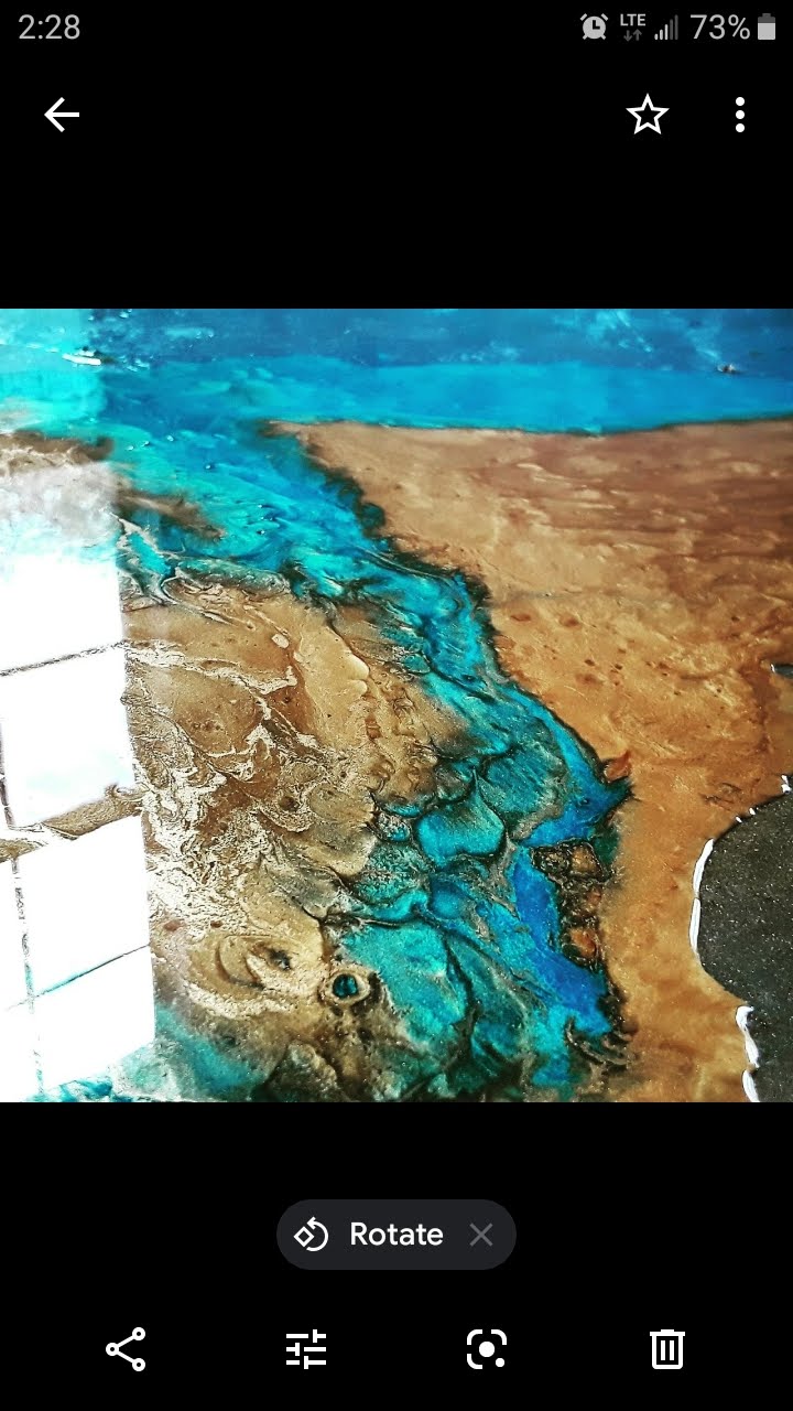 Ocean and copper river metallic epoxy floor — turquoise river meets copper gold sand with mirror-gloss finish, stunning depth, Central Florida