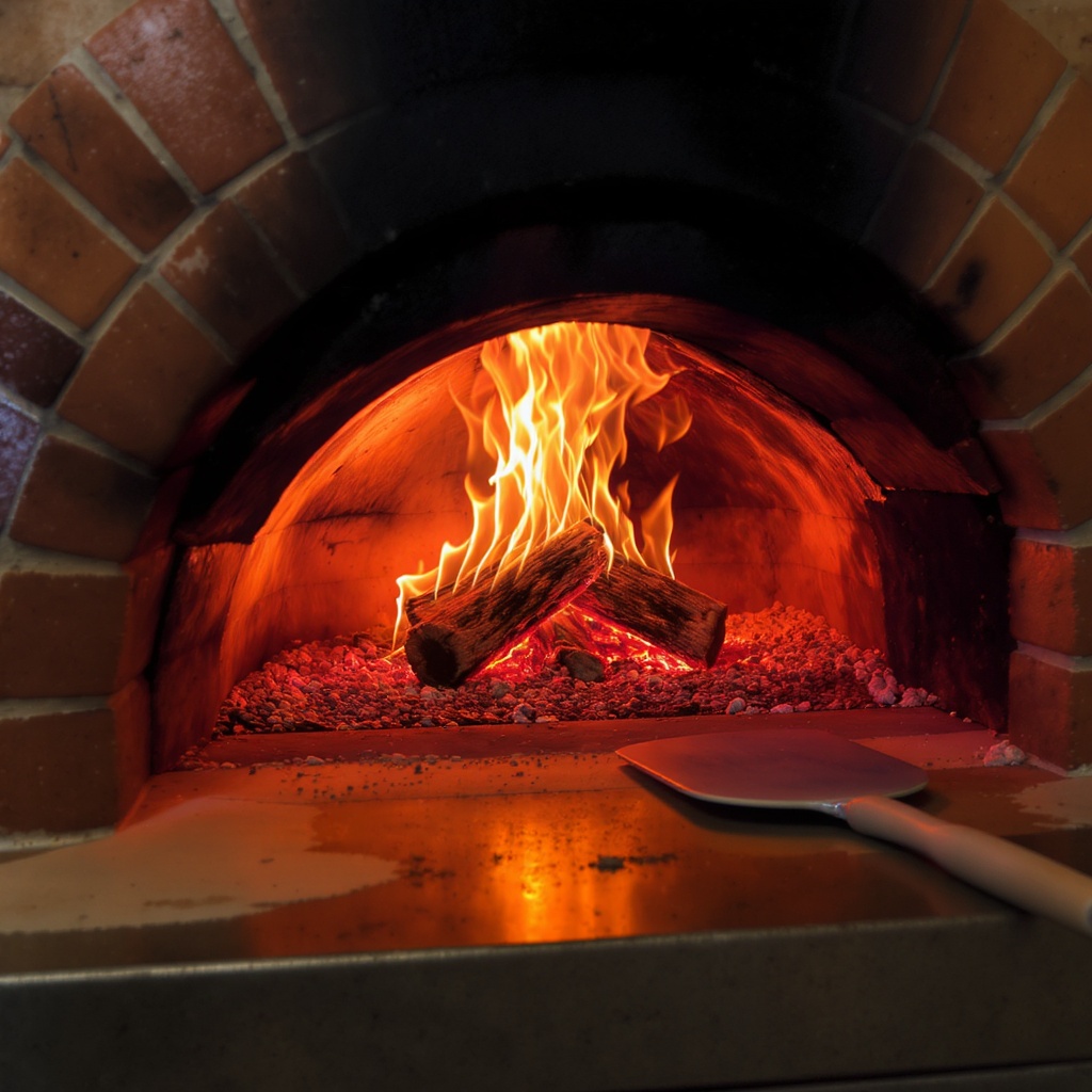Wood-fired oven glow at dinner service